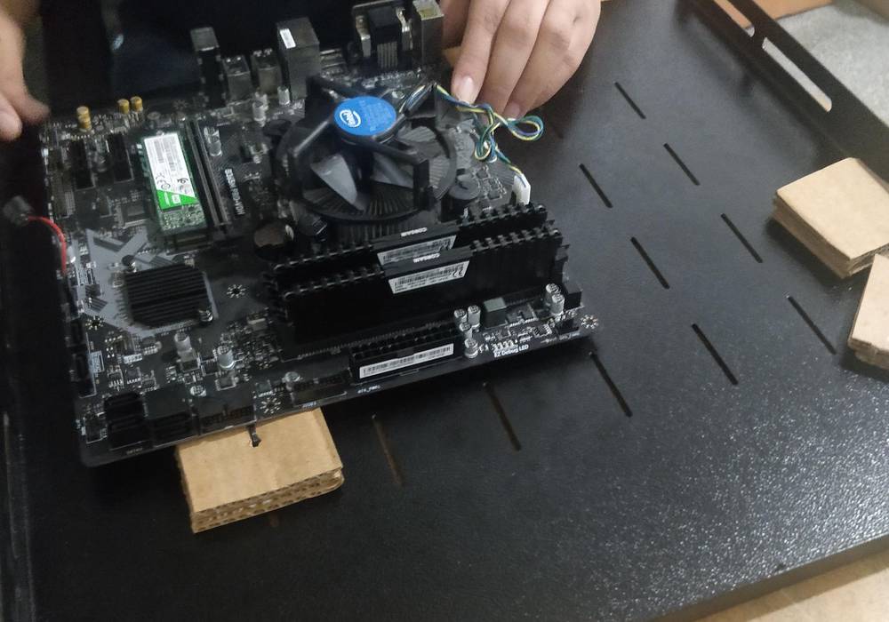 2. Mounting motherboards on server trays (after a few misses, this process has now become a lot more efficient)